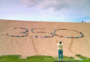 Climate activists gathered at the Sleeping Bear Dune Climb this fall to join the worldwide 350 campaign and call on politicians to push carbon emissions back to 350 parts per million, to stave off global climate change. View a video of the gathering on our homepage, www.glenarborsun.com. Photo by Ken Scott